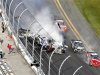 NASCAR driver Kyle Larson and his Chevrolet end up in the fence during the final lap crash during the during the NASCAR Nationwide Series 32nd Annual DRIVE4COPD 300 at the Daytona International Speedway in Daytona Beach