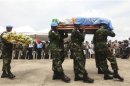U.N. peacekeepers from Bangladesh carry the coffin of one of seven U.N. peacekeepers from Niger who were killed on June 8, 2012 in western Ivory coast near the Liberia border, during a ceremony at U.N. headquarters in Abidjan