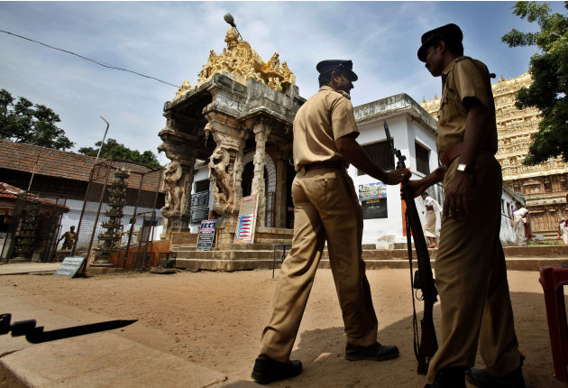 Policemen change guard outside the 16th-century Sree Padmanabhaswamy Temple in Trivandrum, India, Tuesday, July 5, 2011. A vast treasure trove revealed in recent days has instantly turned the Sree Pad
