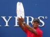 Woods lifts The Players Championship trophy in the air after winning the PGA golf tournament in Ponte Vedra Beach