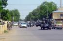 Police and soldiers patrolling outside the police headquarters in N'Djamena on June 15, 2015
