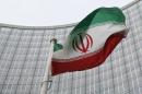 An Iranian flag flutters in front of the IAEA headquarters in Vienna