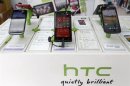 HTC smartphones are displayed in a mobile phone shop in Taipei