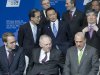 German Central Bank Governor Jens Weidmann, front left, German Finance Minister Wolfgang Schauble, front center, Governor of the Bank of Japan, Masaaki Shirakawa, rear left, talks with Japanese Finance Minister Taro Aso, center, and South Korea Central Bank Governor Kim Choong-soo, rear right, attend a group photo ceremony at a meeting of G20 Finance Ministers and Central Bank Governors in Moscow, Russia, Saturday, Feb. 16, 2013. (AP Photo/Misha Japaridze)