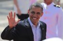 President Barack Obama waves as he arrives at the Convention Center for the second working session of the sixth Summit of the Americas in Cartagena, Colombia, Sunday April 15, 2012. (AP Photo/Fernando Llano)