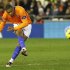 Malaga's Baptista shoots to score a goal against Valencia during their soccer match at the Mestalla Stadium in Valencia