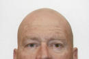 In this undated photo provided by New Zealand Police, John Henry Tully, 48, poses for a photo. A manhunt for Tully is underway Monday, Sept. 1, 2014, after police said a gunman killed two people and injured a third at an unemployment office before escaping on a bicycle in Ashburton, New Zealand. According to police, a man entered a Work and Income New Zealand office and started shooting. (AP Photo/New Zealand Police)