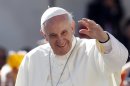Pope Francis waves to faithful as he arrives for his weekly general audience in St. Peter's Square at the Vatican, Wednesday, Sept. 18, 2013. (AP Photo/Riccardo De Luca)