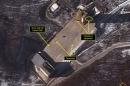 Airbus Defense & Space and 38 North satellite image shows three objects at the base of the gantry tower that are either vehicles or equipment at Sohae Satellite Launching Station in North Korea