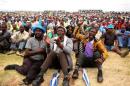 Miners gather at Wonderkop stadium outside the Lonmin mine in Rustenburg, northwest of Johannesburg