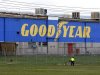 Man walks past the Goodyear logo at the South Pacific Tyres facility in Somerton