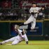 Pittsburgh Pirates shortstop Ronny Cedeno, right, leaps to take a high throw from catcher Ryan Doumit as Houston Astros' Jason Bourgeois (11) steals second base during the eighth inning of a baseball game, Monday, Aug. 29, 2011, in Houston. (AP Photo/Dave Einsel)
