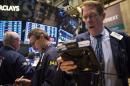 Traders work on the floor of the New York Stock Exchange