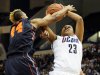 Connecticut's Kaleena Mosqueda-Lewis, right, is fouled by Syracuse's Carmen Tyson-Thomas, left, in the first half of an NCAA college basketball game in the semifinals of the Big East Conference women's tournament in Hartford, Conn., Monday, March 11, 2013. (AP Photo/Jessica Hill)
