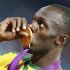 Jamaica's Usain Bolt kisses his gold medal during the presentation ceremony for the men's 200m event at the London 2012 Olympic Games at the Olympic Stadium
