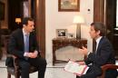 Handout picture released by the Syrian Arab News Agency on April 20, 2015 shows Syrian President Bashar al-Assad answering questions from France 2 journalist David Pujadas during an interview in Damascus