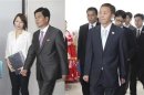 Head of the South Korean working-level delegation Kim and his North Korean counterpart Park arrive for their talks at the Kaesong Industrial District Management Committee in Kaesong