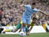 Aguero of Manchester City evades a tackle from Ward of Norwich City during their English Premier League soccer match in Norwich, eastern England