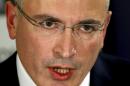 Mikhail Khodorkovsky speaks during a news conference in Berlin, Sunday, Dec. 22, 2013. The former oil baron and prominent critic of Russian President Vladimir Putin, Mikhail Khodorkovsky, was reunited with his family in Berlin on Saturday, a day after being released from a decade-long imprisonment in Russia. (AP Photo/Michael Sohn)