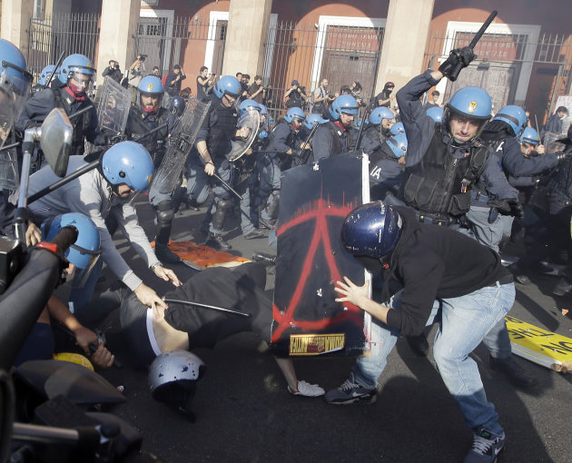 Police clash with demonstrators during a protest against Italian Government austerity measures in Rome, Wednesday, Nov. 14, 2012. Workers across the European Union sought to present a united front aga