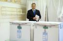 Hungarian Prime Minister and Chairman of center right Fidesz party Viktor Orban before casting his vote during municipal elections in Budapest, Hungary, Sunday, Oct. 12, 2014. (AP Photo/MTI, Szilard Koszticsak)