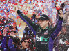 Denny Hamlin celebrates in victory lane after winning the NASCAR Sprint Cup Series auto race at Kansas Speedway in Kansas City, Kan., Sunday, April 22, 2012. (AP Photo/Orlin Wagner)