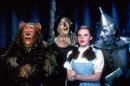 FILE- This 1939 file photo provided by Warner Bros. shows, from left, Bert Lahr as the Cowardly Lion, Ray Bolger as the Scarecrow, Judy Garland as Dorothy and Jack Haley as the Tin Woodman in a scene from "The Wizard of Oz." Judy Garland's original costume from "The Wizard of Oz" will be up for sale at Julien's Auctions in November 2012. (AP Photo/Warner Bros., File)