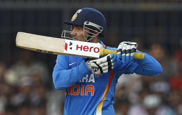India&#39;s captain Virender Sehwag bats during their fourth one day international cricket match against West Indies&#39; in Indore, India, Thursday, Dec. 8, 2011. Opener Sehwag who made 219 runs brok