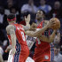 Charlotte Bobcats' Gerald Henderson (15) drives between New Jersey Nets' Deron Williams (8) and MarShon Brooks (9) during the first half of an NBA basketball game, Sunday, March, 4, 2012, in Charlotte, N.C.  (AP Photo/Rick Havner)