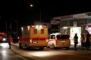 German emergency services workers work in the area where a man with an axe attacked passengers on a train near Wuerzburg
