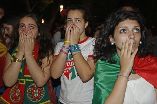 Portuguese soccer fans react at end of Euro 2012 semi final soccer match between the Portugal and Spain at a public screening in Lisbon