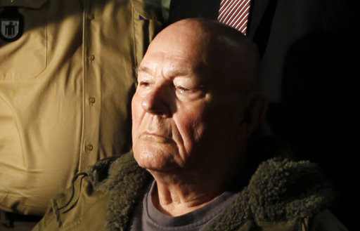 In this May 12. 2011 file picture John Demjanjuk waits in a courtroom in Munich. German prosecutors tell The Associated Press they have reopened hundreds of dormant investigations of former Nazi death camp guards and others