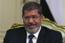 Egypt's President Mursi participates in a meeting with U.S. Defense Secretary Panetta at the presidential palace in Cairo