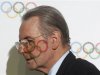 IOC President Rogge leaves after a news conference in St. Petersburg