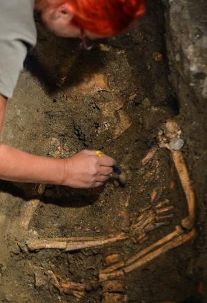 An archaeologist works inside the medieval Convent …