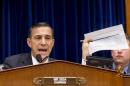 House Oversight Committee Chairman Rep. Darrell Issa, R-Calif., holds up a checklist related to the preparation for the implementation of the Obamacare healthcare program, and specifically, the HealthCare.gov website, on Capitol Hill in Washington, Wednesday, Nov. 13, 2013. Issa wants to know why the administration required consumers to first create online accounts at HealthCare.gov before they could shop for health plans, a decision runs counter to the common e-commerce practice of allowing anonymous window-shopping. (AP Photo/J. Scott Applewhite)