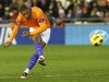 Malaga's Baptista shoots to score a goal against Valencia during their soccer match at the Mestalla Stadium in Valencia