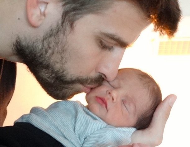Shakira shows FC Barcelona star Gerard Pique kissing the cheek of his son Milan (AP)
