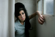 FILE - In this Feb. 16, 2007 file photo, British singer Amy Winehouse poses for photographs after being interviewed by The Associated Press at a studio in north London, Friday, Feb. 16, 2007. British police say singer Amy Winehouse has been found dead at her home in London on Saturday, July 23, 2011. The singer was 27 years old. (AP Photo/Matt Dunham, File)