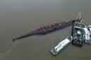 An aerial view shows rescue workers searching on the sunken ship at Jianli section of Yangtze River