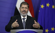 Egyptian President Mohamed Morsi gestures while speaking during a media conference at EU headquarters in Brussels on Thursday, Sept. 13, 2012. This is Egyptian President Mohammed Morsi's first trip to the European Union since being elected president. (AP Photo/Virginia Mayo)