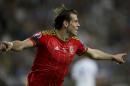 Wales' Gareth Bale celebrates his second goal against Israel during Euro 2016 group B qualifying soccer match in Haifa, Israel, Saturday, March 28, 2015. (AP Photo/Ariel Schalit)