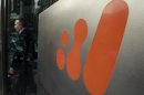 A man walks out of the head office of BHP Billiton in central Melbourne