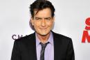 FILE - In this April 11, 2013 file photo, Charlie Sheen, a cast member in "Scary Movie V," poses at the Los Angeles premiere of the film at the Cinerama Dome in Los Angeles. Los Angeles police said Wednesday, April 6, 2016, that detectives are investigating Sheen in response to a criminal report filed last week and have obtained a search warrant. The website RadarOnline reported Wednesday that the warrant was served on its operators in an attempt to obtain audio in which Sheen purportedly threatens his ex-fiancee, Scottine Ross. (Photo by Chris Pizzello/Invision/AP, file)