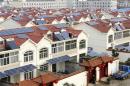 Solar panels are seen on the roofs of residential houses in Qingnan village of Lianyungang