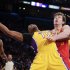 Los Angeles Lakers' Dwight Howard, center, is fouled by Houston Rockets' Omer Asik, of Turkey, during the first half of an NBA basketball game in Los Angeles, Wednesday, April 17, 2013. (AP Photo/Jae C. Hong)