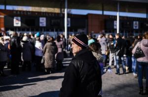 People queue to receive humanitarian aid at the Dombass &hellip;