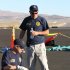 In this handout photo from the National Traffic Safety Board taken Sunday, Sept. 18, 2011 at an airfield in Reno, Nev., shows two NTSB officials looking at wreckage from Jimmy Leeward's plane that crash on Friday. Officials say nine people died.  (AP Photo/National Traffic Safety Board, HO)