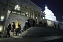 Members of the U.S. House of Representatives depart after a late-night vote on fiscal legislation to end the government shutdown, at the U.S. Capitol in Washington