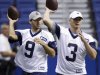 Dallas Cowboys quarterback Tony Romo (9) and Jon Kitna (3) take part in a drill during NFL football training camp, Friday, July 29, 2011, in San Antonio. (AP Photo/Eric Gay)